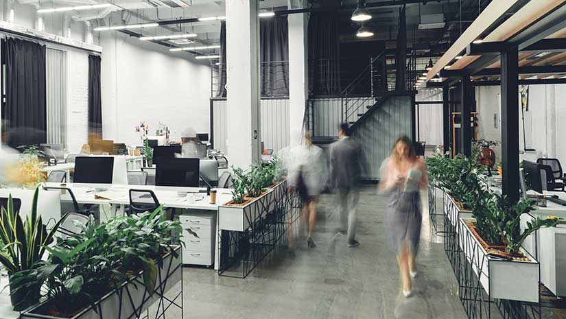 Modern open space office interior with blurred business